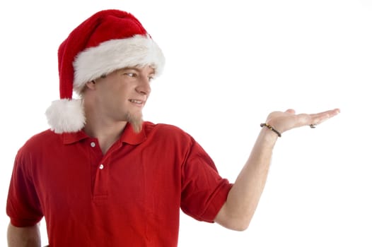 christmas hat wearing male looking at palm on an isolated white background