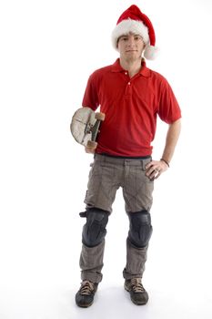 christmas hat wearing male standing with skateboard on an isolated background