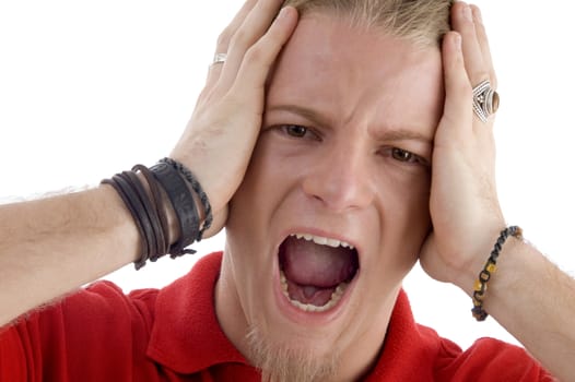 male holding his head and shouting with white background