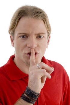 handsome young guy shushing against white background