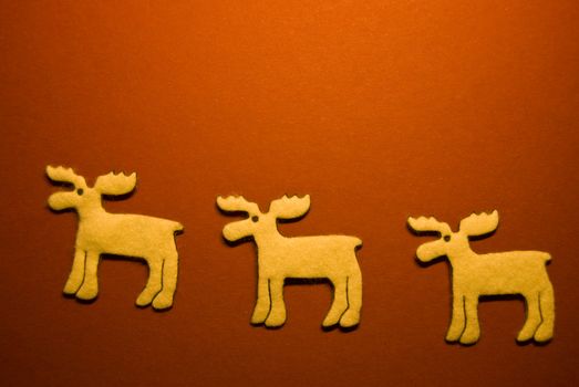 three reindeers on red paper (xmas motif)