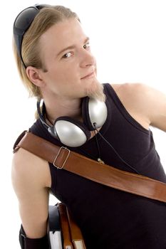 smart student with books and headphones on an isolated background