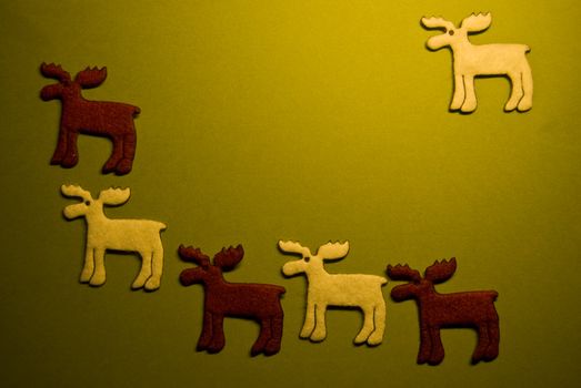 six reindeers on green paper (xmas motif)