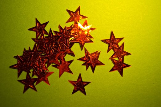 lots of red stars on green paper