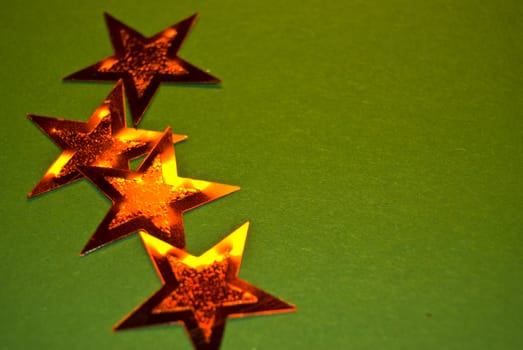 lots of red stars on green paper