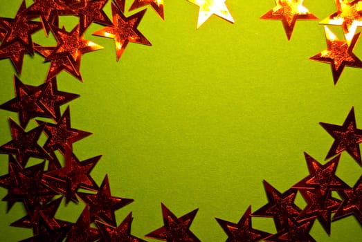 lots of red stars on green paper