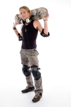 young male holding skateboard on his neck back with white background