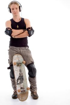 handsome guy posing with skateboard against white background