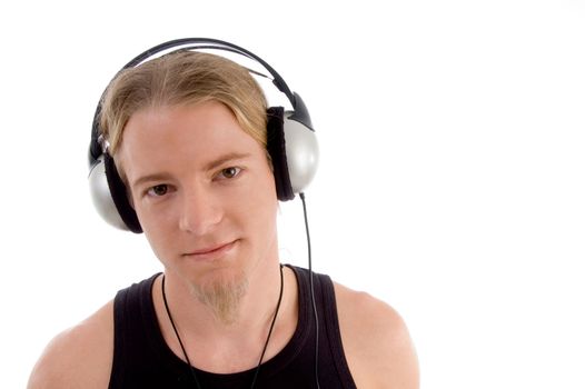 handsome man listening to music with white background