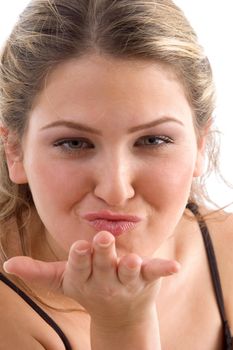 pretty woman giving flying kiss on an isolated background