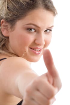 young pretty female showing thumbs up on an isolated background