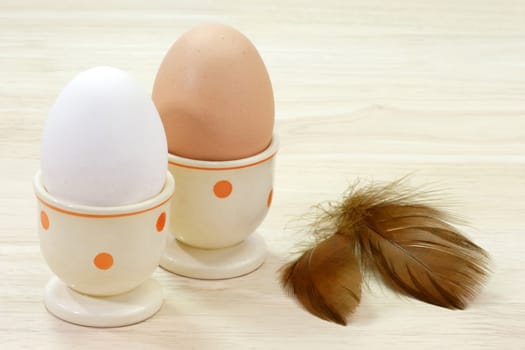 Brown and white hens egg in eggcups