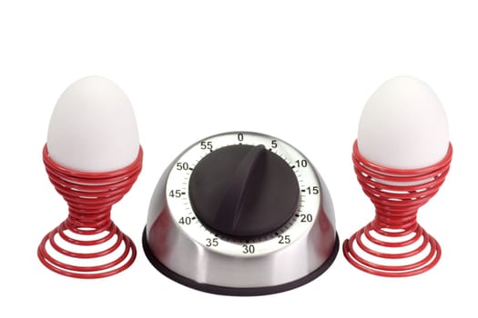Egg timer with twoh eggs in eggcups - isolated on white background