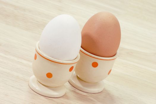 White and brown egg in an eggcup