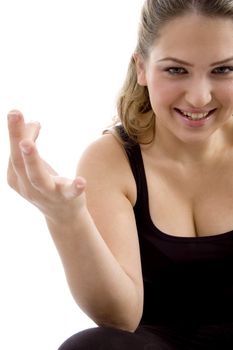 smiling girl showing hand gesture on an isolated background