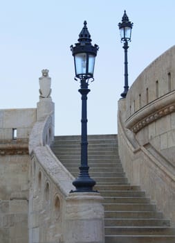 Old lights of the castle stairs rail.