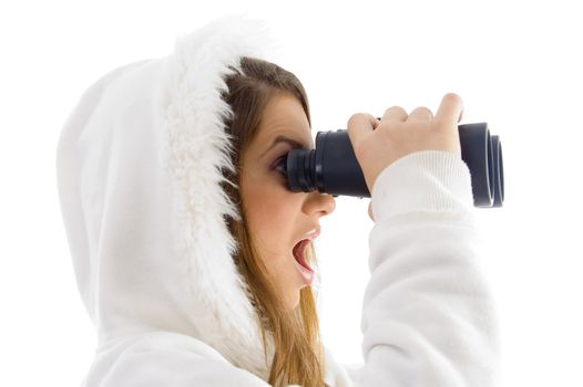 astonished female watching through binocular on an isolated background