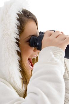 happy female using binocular to watch against white background