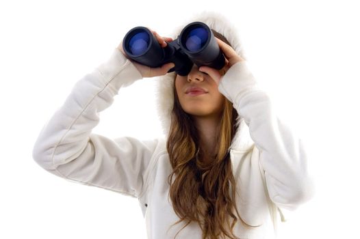 attractive model watching through binocular on an isolated white background