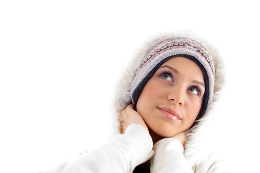 female posing in winter wear against white background