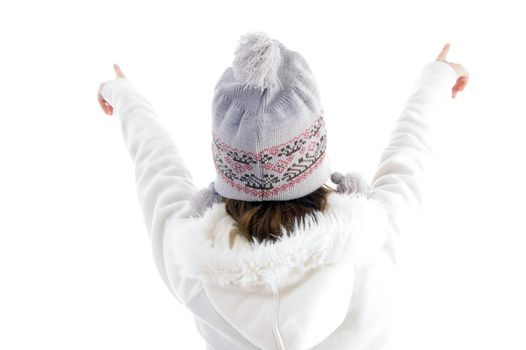 girl pointing with both hands against white background