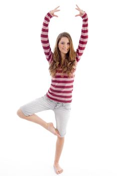 young female doing exercise on an isolated background