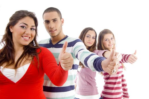 happy young friends with thumbs up against white background