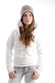 standing female in winter wear against white background