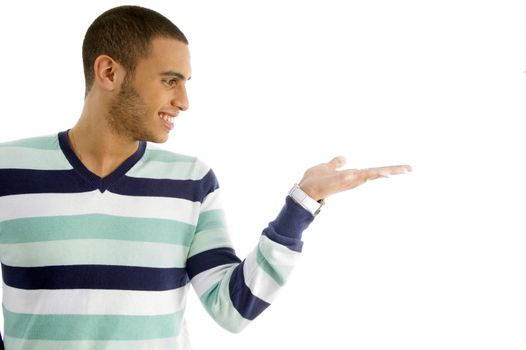 handsome male holding something with hand gesture against white background