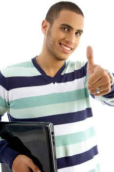 smiling guy holding notebook showing thumbs up on an isolated white background