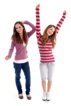 two girls showing happiness together on an isolated white background