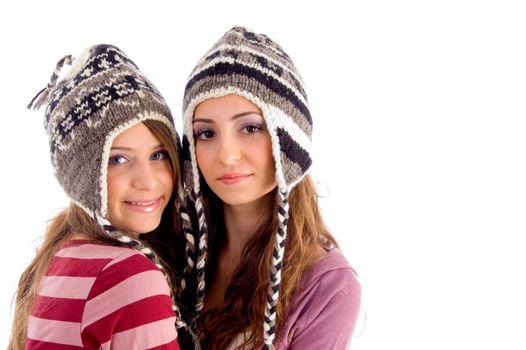 close up view of teens friends smiling and looking at camera against white background