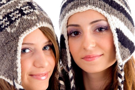 close up view of cute teens wearing woolen cap on an isolated white background