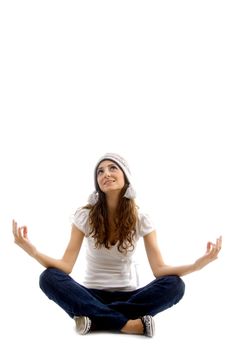 health conscious girl doing meditation against white background