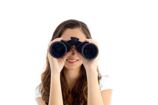 smiling female watching through binocular against white background