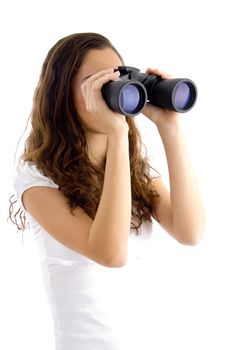 attractive model watching through binocular with white background