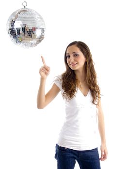 beautiful female pointing at mirror ball against white background