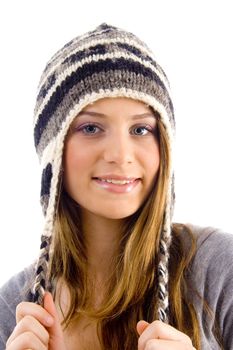 portrait of attractive female wearing woolen cap on an isolated background