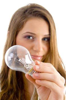 beautiful female holding light bulb against white background