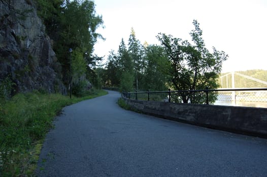 Turist road leading from the old fossum brigde, crossing the river Glomma. Norway