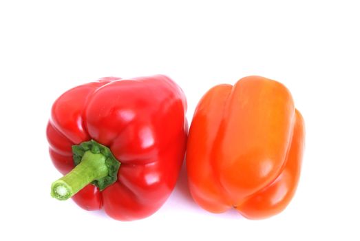 Red and orange pepper are on the white background