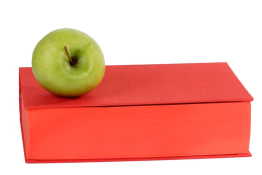 Red Book with green apple - isolated on white background