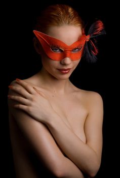 Topless female in red mask