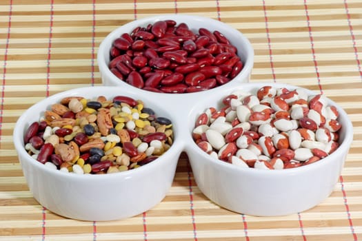 Mixed colorful beans in a white bowl