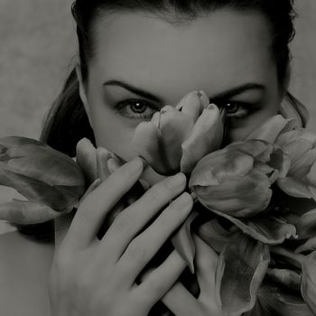 grey female portrait with tulips