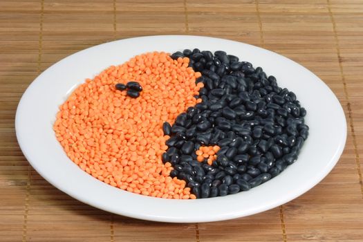 Yin Yang symbol made from different beans