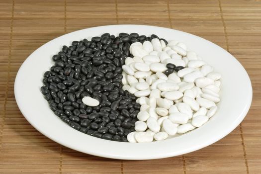 Yin Yang symbol made from different beans
