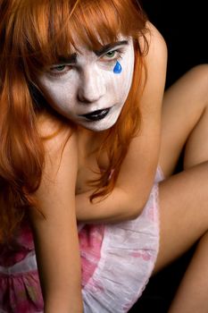 sad clown-face makeup girl