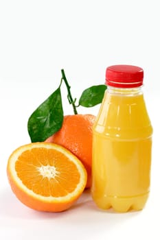 Fresh Orange with Orange Juice in the bottle on bright background. 