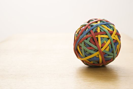 Still life of colorful rubber band ball.